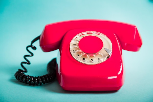 Retro red telephone on  background