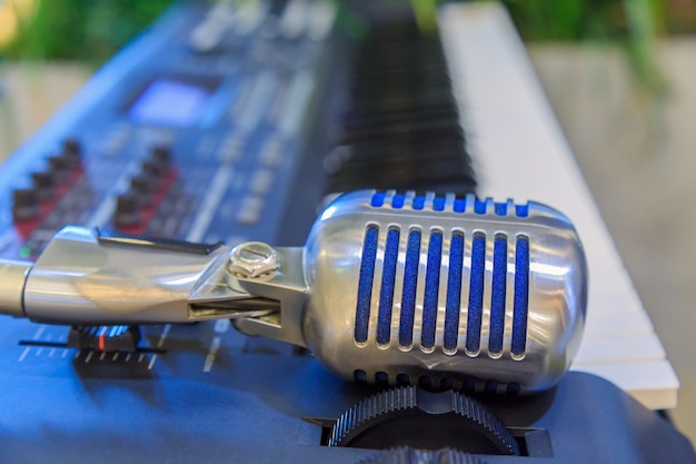 A retro shape microphone on the electronic keyboard