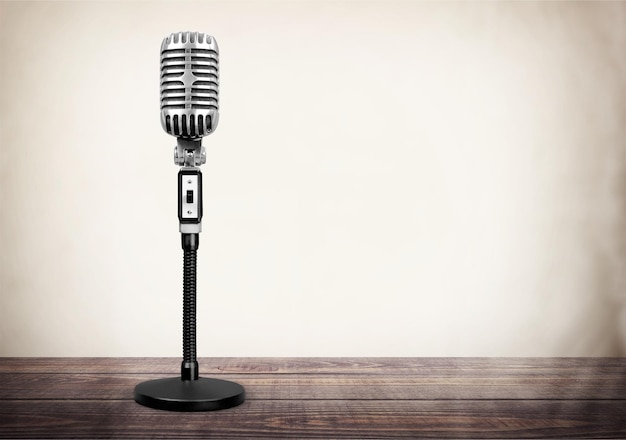 Retro style microphone on  background