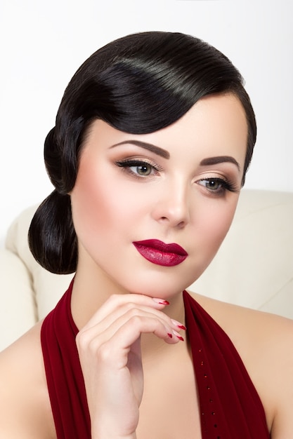 Retro style portrait of thoughtful brunette woman