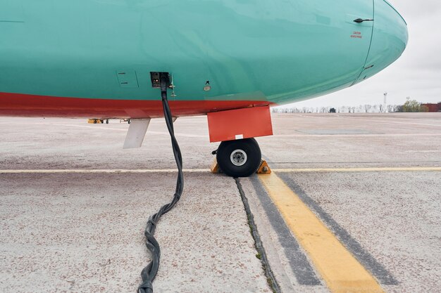 Retro style Turboprop aircraft parked on the runway at daytime