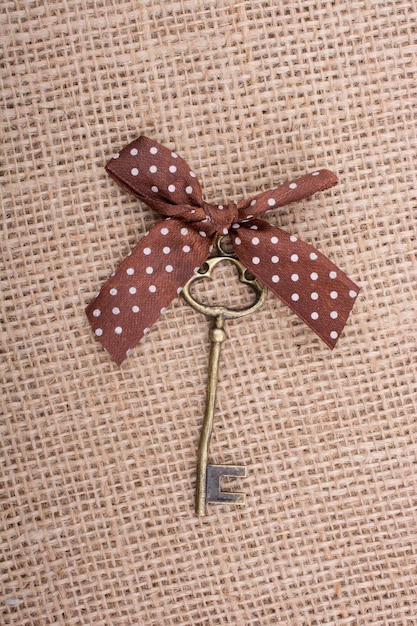 Photo retro styled key with a ribbon on it