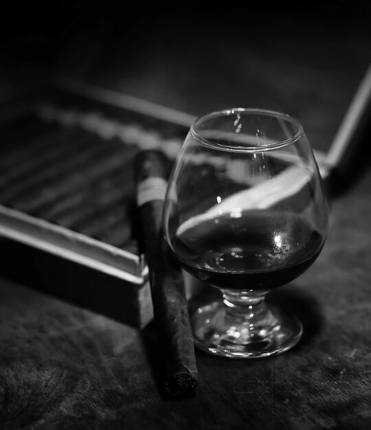 Retro styled photo of large box of Cuban cigars on a wooden table in a presentable package