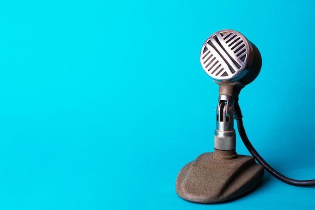 Retro stylish microphone on a blue background