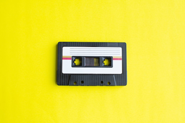 Retro of tape cassette on yellow background. soft focus