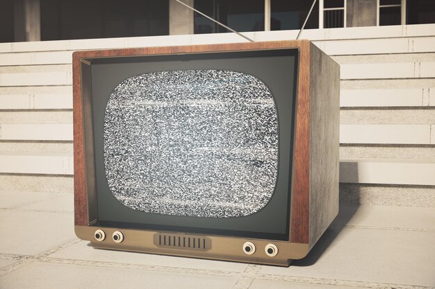 Photo retro tv next to concrete building