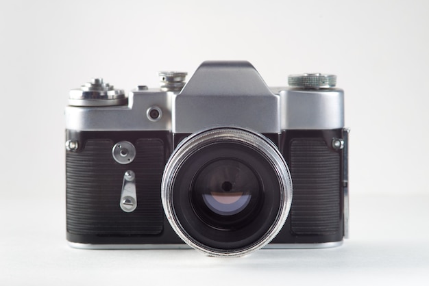 Retro vintage film camera on white background