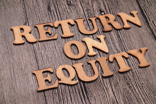 Return on Equity ROE text words typography written on wooden background life and business