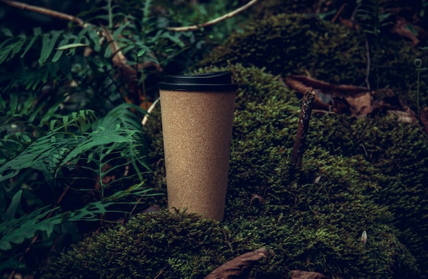 Reusable cork coffee cup in the forest.