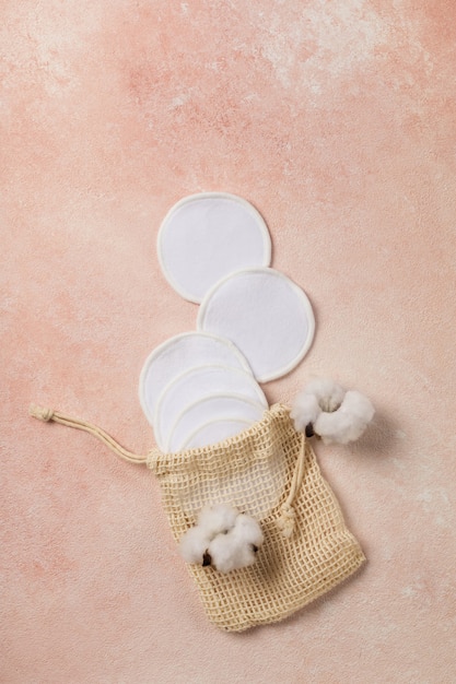 Reusable cotton pads on pink background