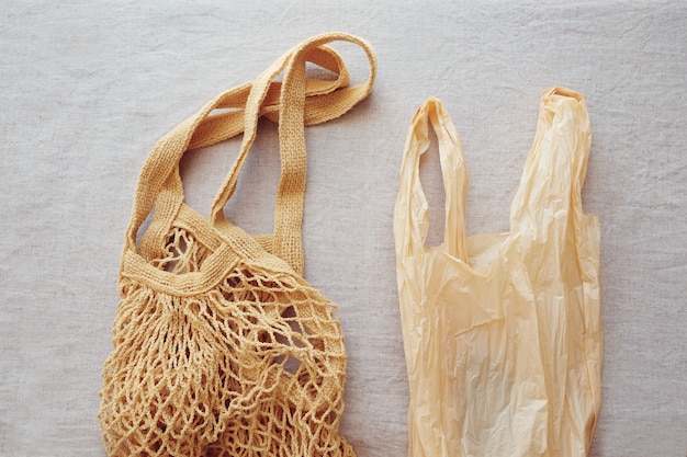 Reusable cotton shopping bag and plastic bag, plastic free and zero waste concept