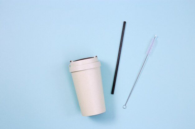 Reusable eco friendly bamboo cup for takeaway coffee and metal drinking straw, zero waste