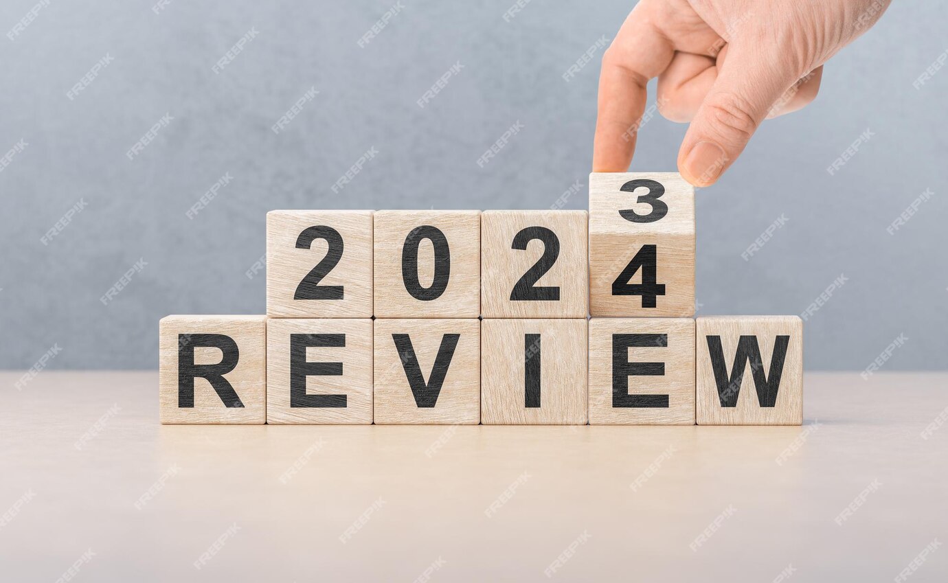 Premium Photo Review 2024 hand flips wooden cube and changes words
