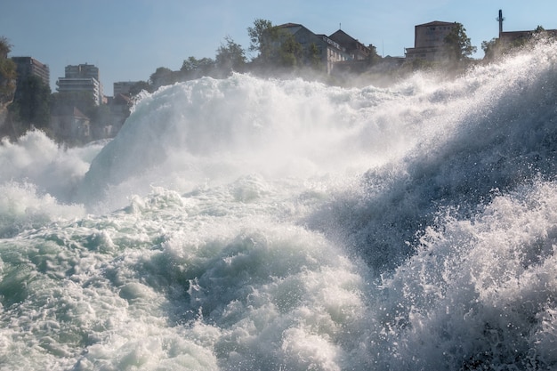 The Rhine Falls is the largest waterfall in Europe in Schaffhausen, Switzerland. Summer landscape, sunshine weather, blue sky and sunny day