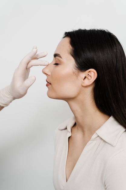 Rhinoplasty is reshaping nose surgery for change appearance of the nose and improve breathing Consultation with ENT before rhinoplasty plastic surgery to change nose shape and improve breathing