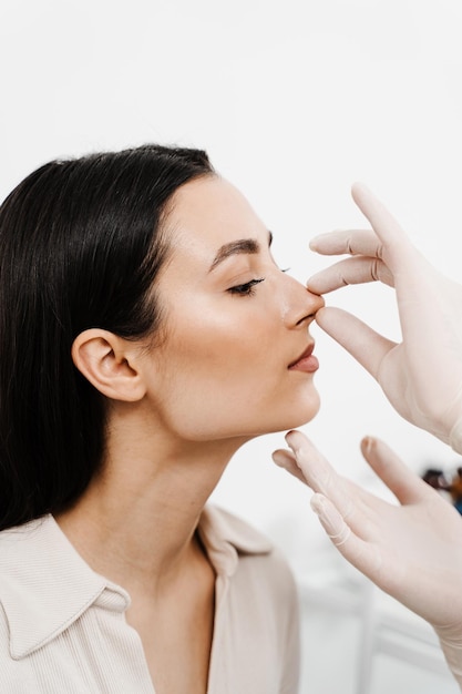 Rhinoplasty is surgical procedure that involves altering shape of nose to improve appearance and enhance breathing ENT consultation before rhinoplasty plastic surgery