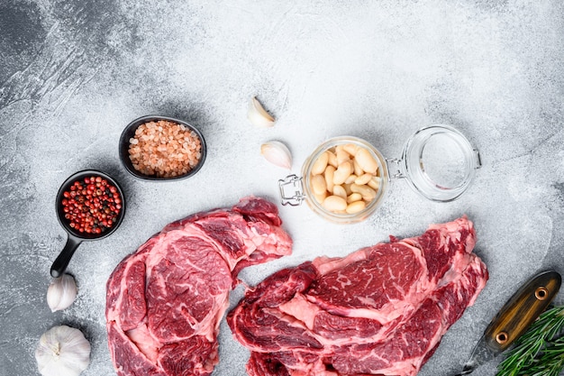 Rib eye ingredients with beans set, top view flat lay