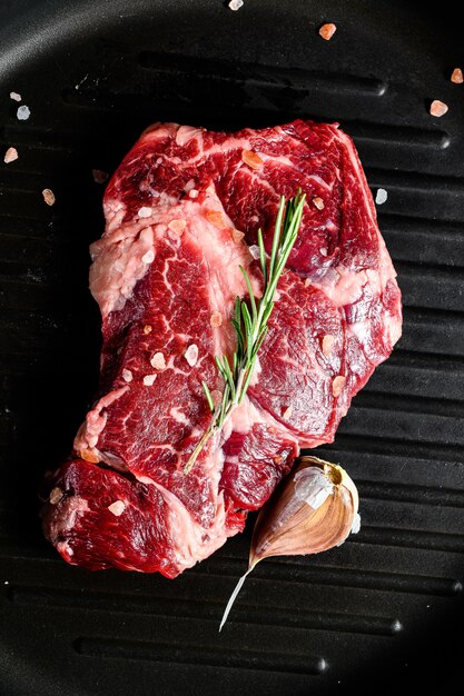 Rib eye steak, fillet of beef. Organic farm meat. Black background