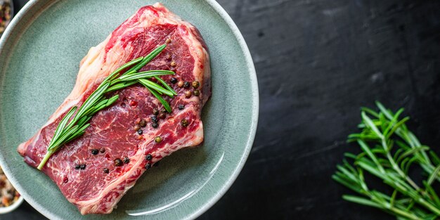 Rib-eye steak with spices on a plate