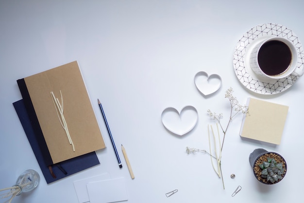 Ribbon hearts, notebook and coffee on white background, Valentines day.