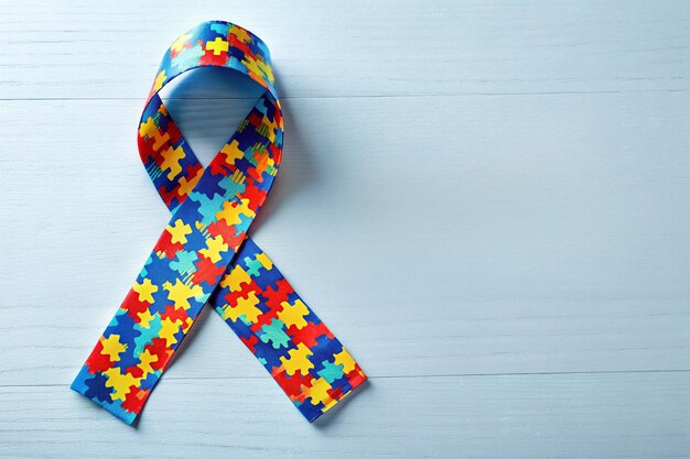 a ribbon with multi colored squares that says quot puzzle quot