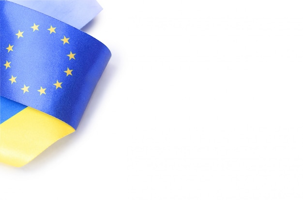 Ribbon with Ukrainian and European union flags isolated on white background