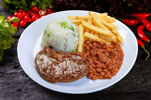 Rice beans french fries and meat