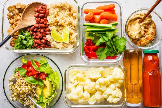 Rice, beans, vegetables, hummus and juice. 