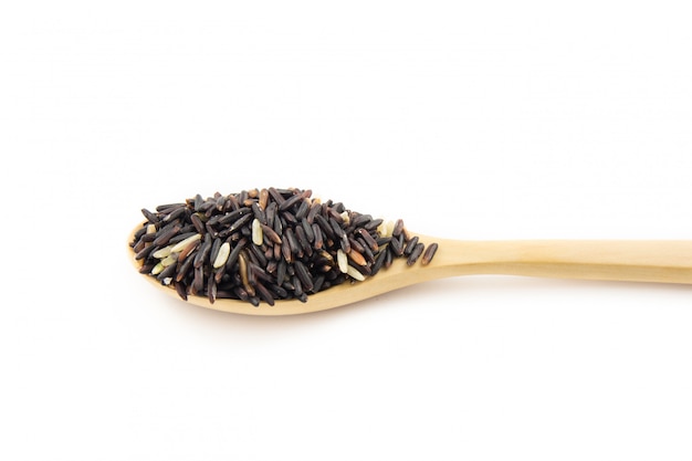 Rice berry in wooden spoon on white background