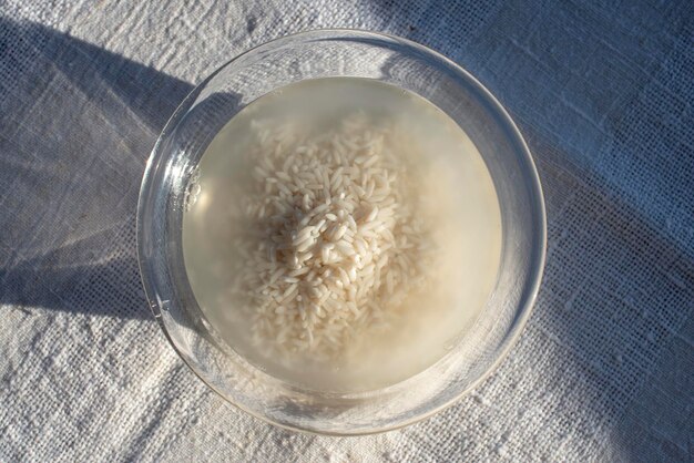 Rice in the bowl with water homemade rice water skincare product