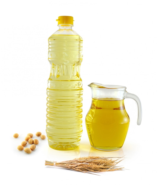 Rice bran oil in bottle glass with seed and soy on white 