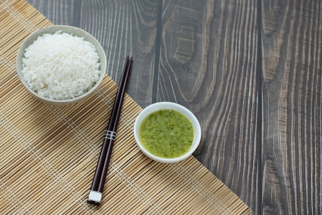 rice and chopsticks on wood table