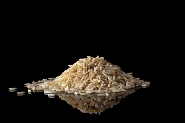 Rice isolated on black surface.