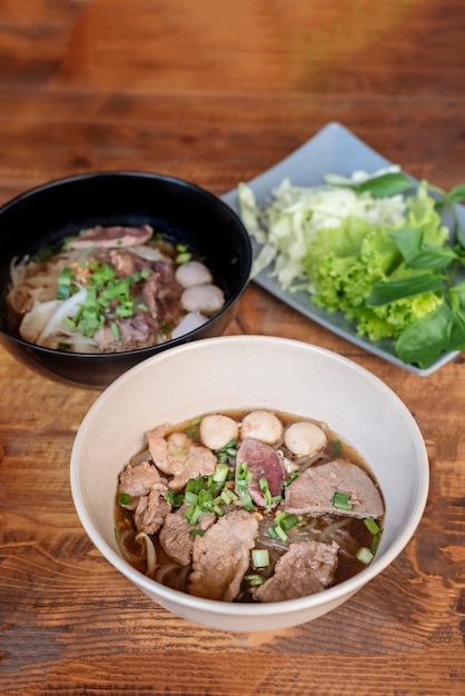 Rice noodle soup with pork and vegetables