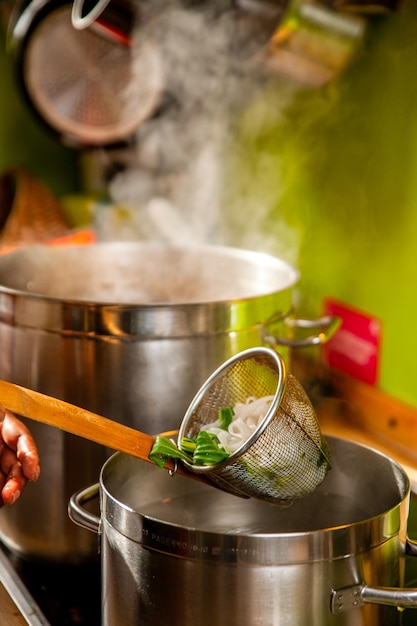 Photo rice noodles are an essential ingredient in a spicy thai soup