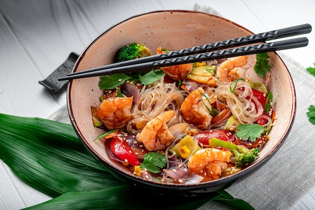 Rice noodles with shrimp and vegetables asian cuisine