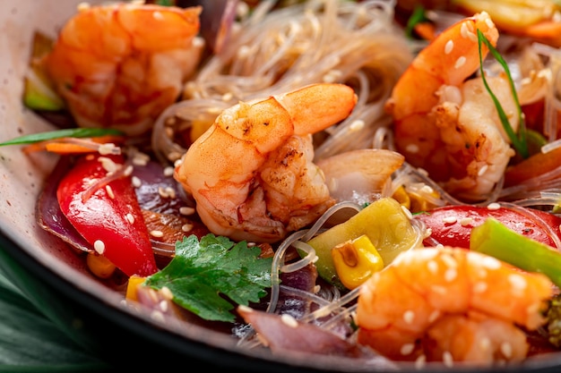 Rice noodles with shrimp and vegetables Asian cuisine