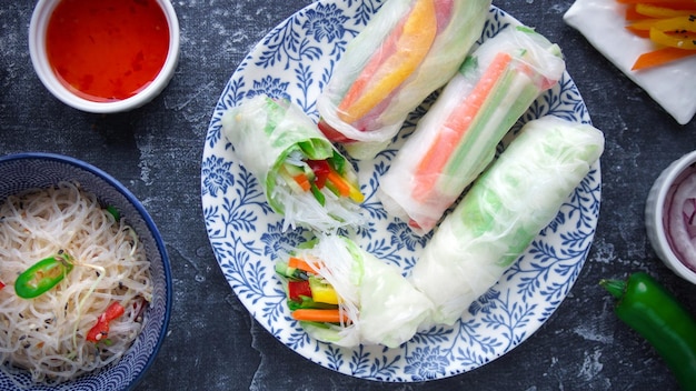 Rice paper rolls with vegetables on a dark background, Vietnamese, Asian food