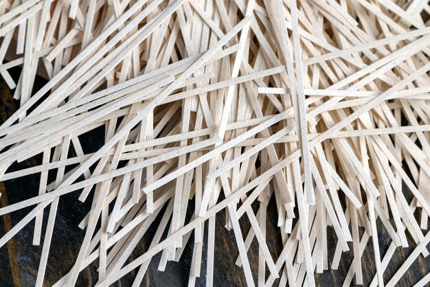 Rice pasta on a table and a wooden board