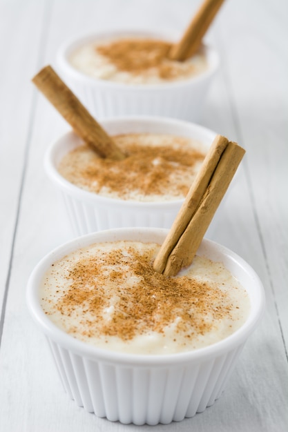 Rice pudding on white wooden table