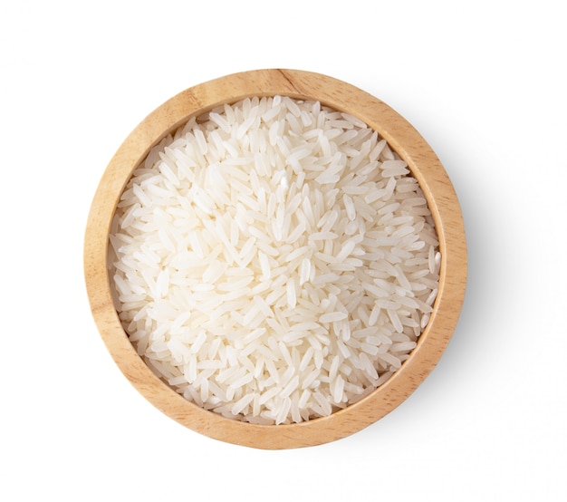 Rice seeds in wood bowl isolated on white background. top view