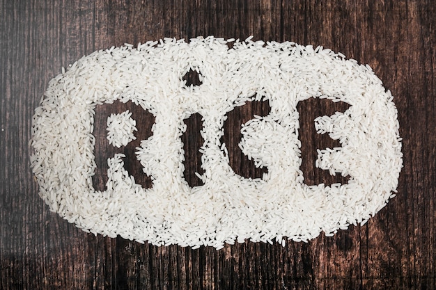 Rice text on black wooden textured background