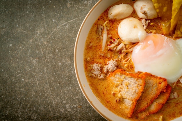 Rice vermicelli noodles with meatball roasted pork and egg in spicy soup