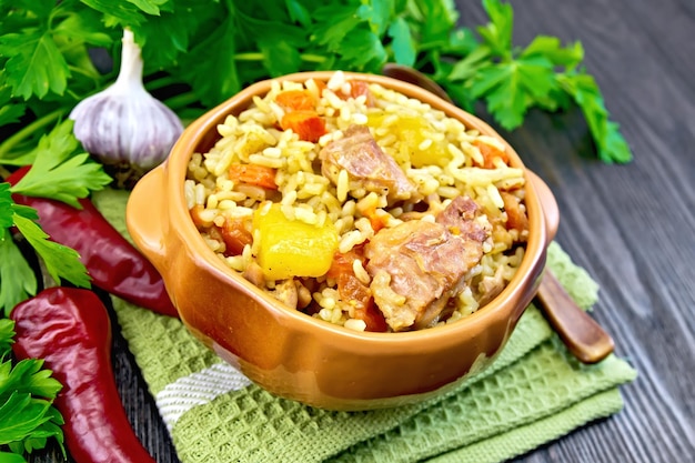 Rice with chicken and zucchini in bowl on board