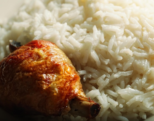 Rice with chiken on white plate