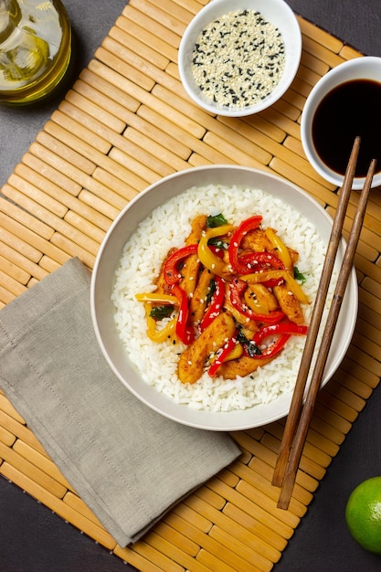 Rice with fried chicken, pepper and sesame. asian food