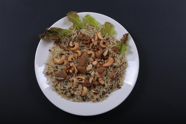 Rice with meat with fried nuts  Free Photo