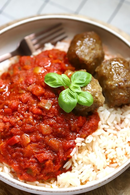 Rice with meatballs and tomato sauce Healthy lunch or dinner