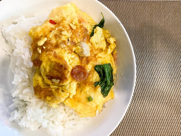 Rice with omelet on the table ready to eat