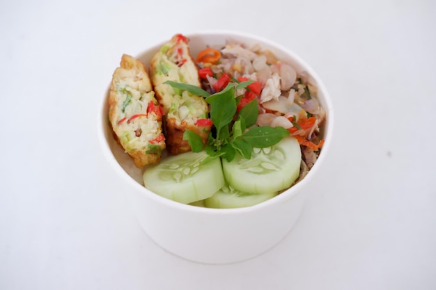 rice with scrambled eggs and vegetables in a cup